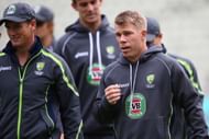 David Warner (R) of Australia warms up pre match alongside captain George Bailey (L) ahead of the ICC Champions Trophy Group A match between Australia and New Zealand at Edgbaston on June 12, 2013 in Birmingham, England. (Photo by Michael Steele/Getty Images)